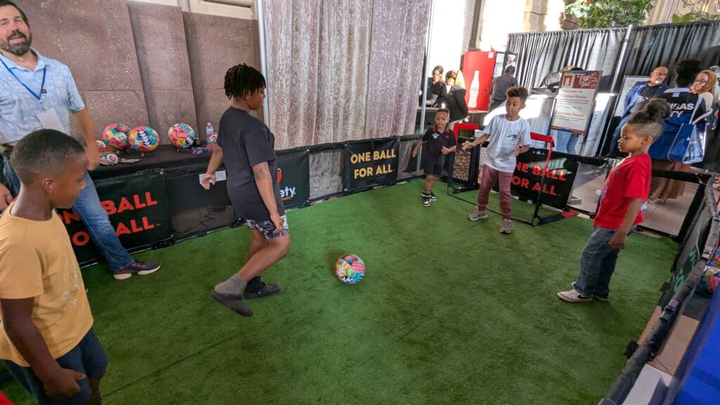 Kids playing on a soccer pitch